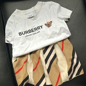 Girls size 4 wool Burberry skirt

Girl size 4 white bear Burberry shirt